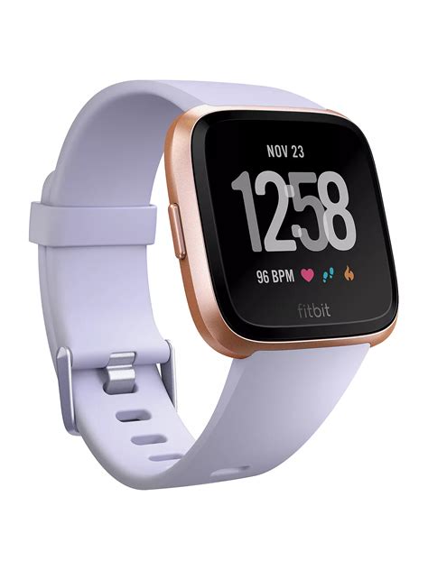 fitbit rose gold smart watch.